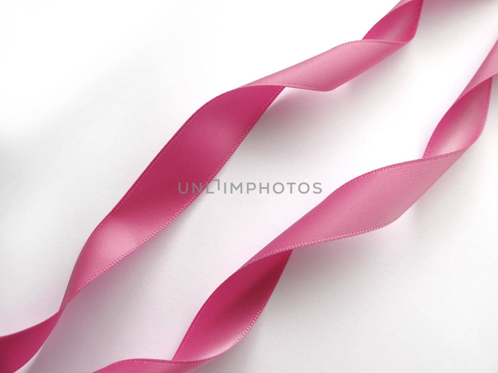 Pink ribbon over white background, design element by aroas