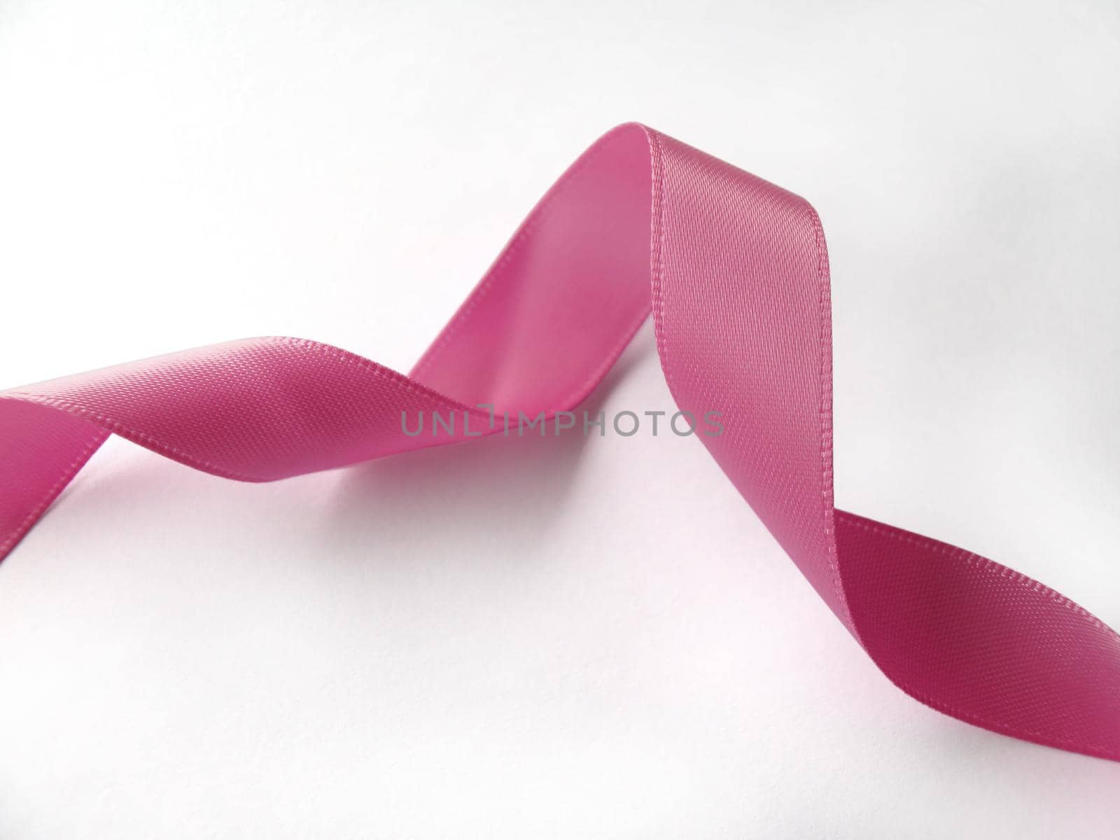 Pink ribbon over white background, design element by aroas