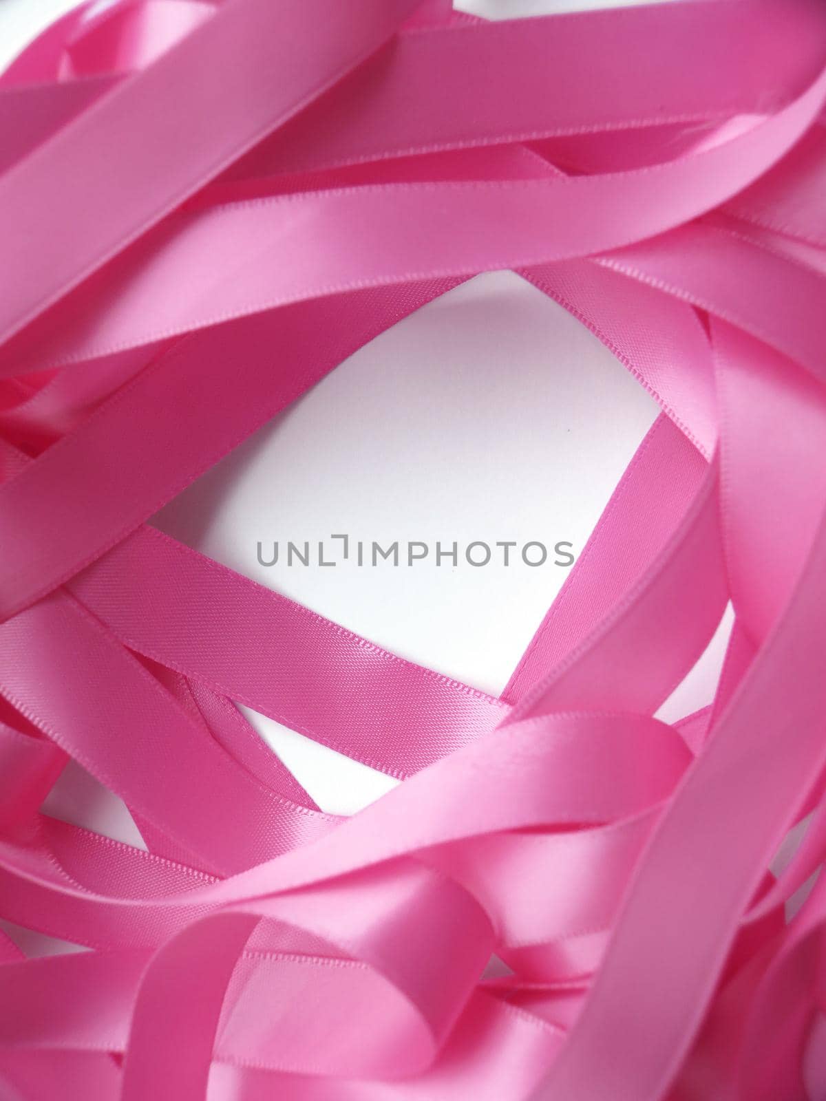 Pink ribbon over white background, design element by aroas