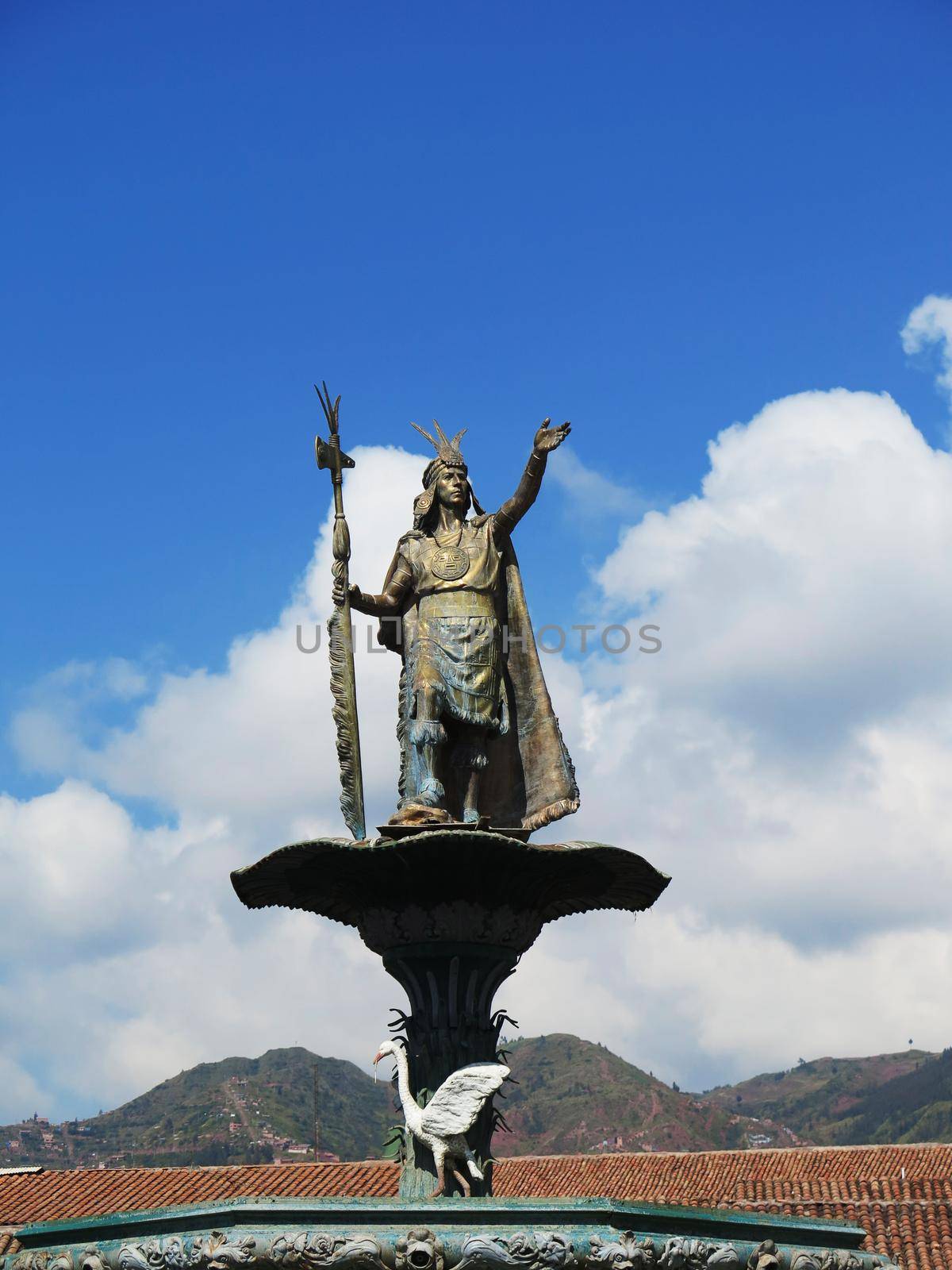 Statue of the Inca Pachacutec over the fountain at the Plaza de Armas in Cuzco by aroas