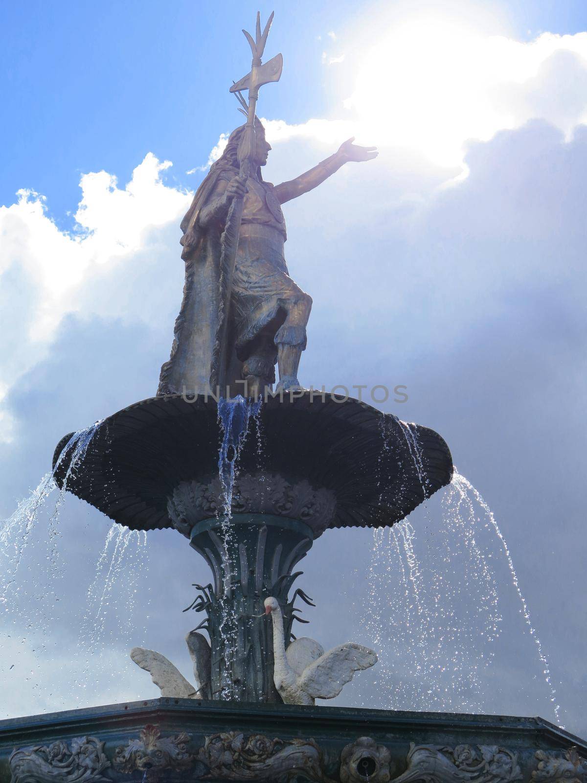 Statue of the Inca Pachacutec over the fountain at the Plaza de Armas in Cuzco, Peru