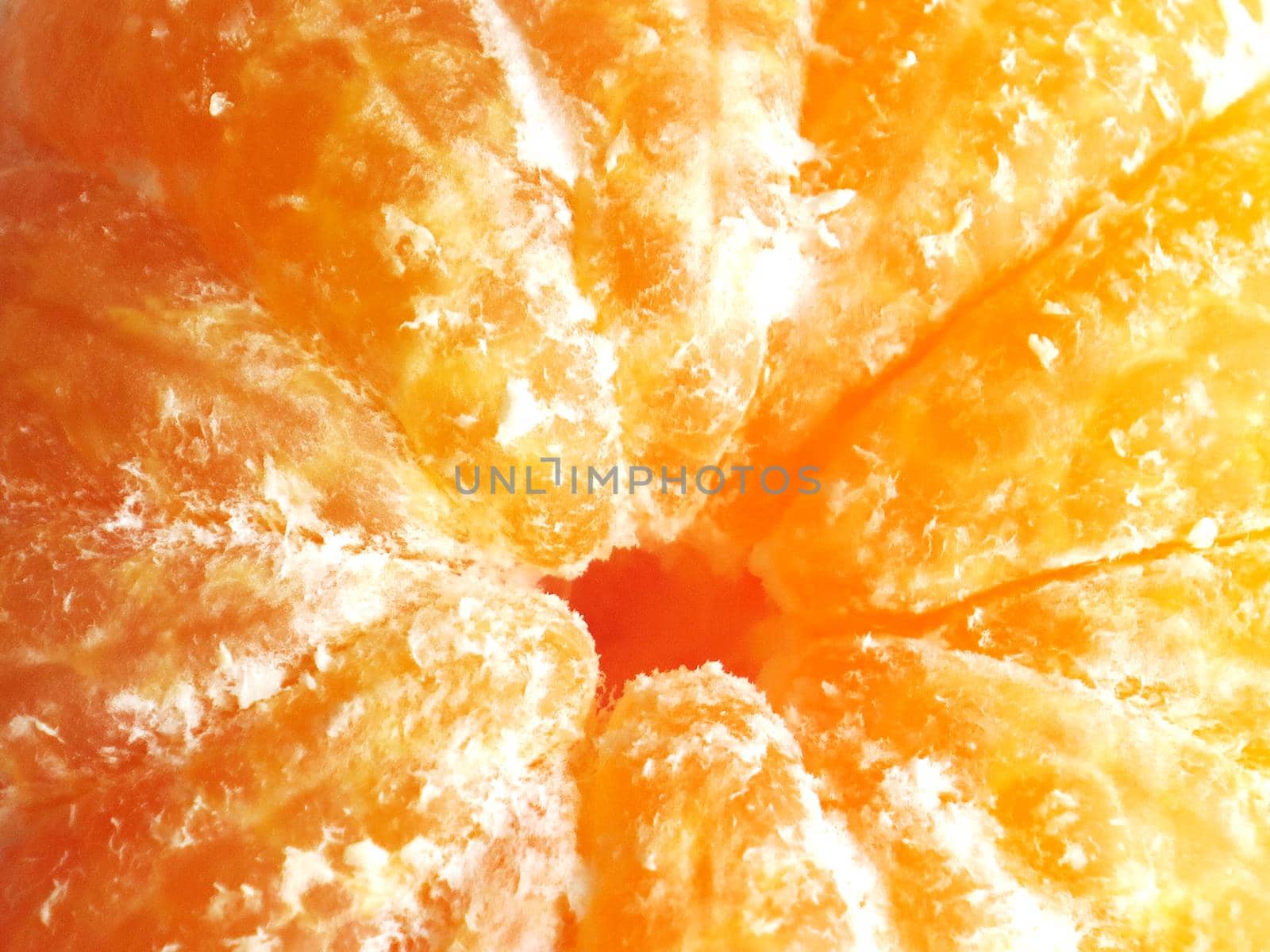 Peeled tangerine or mandarin fruit close up