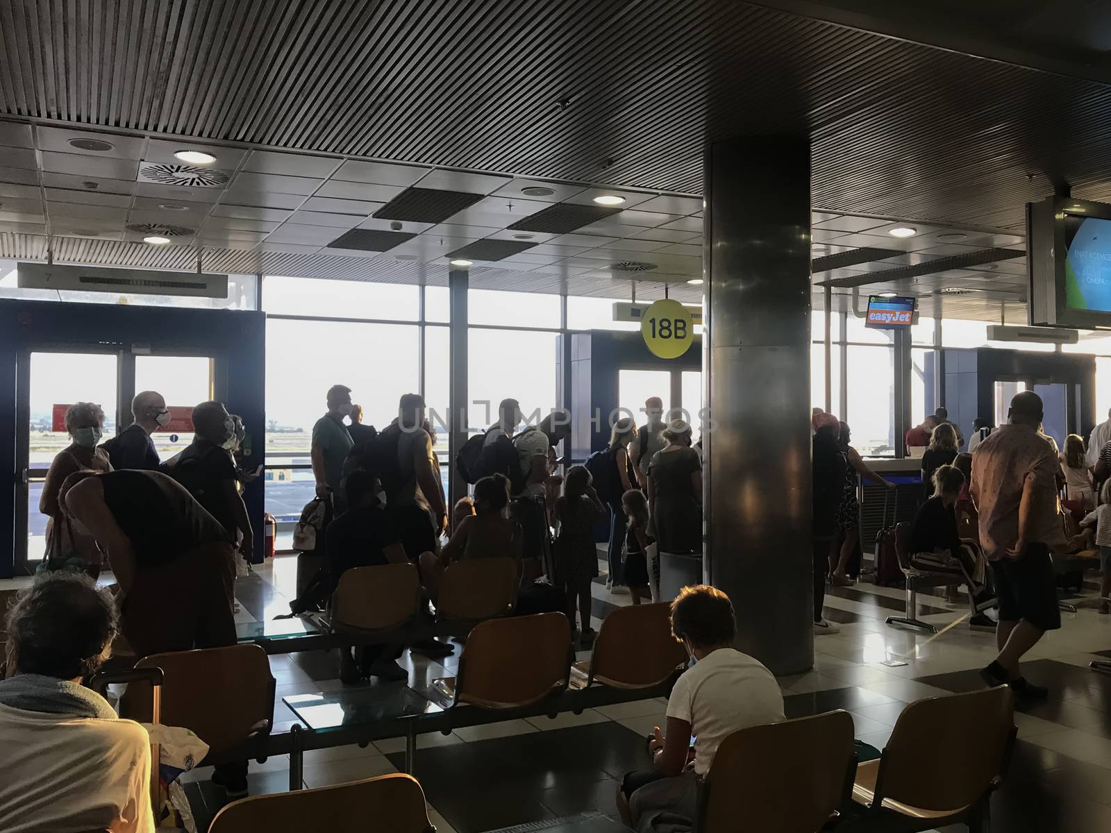 People with face protection prior to departure in International Airport Macedonia.