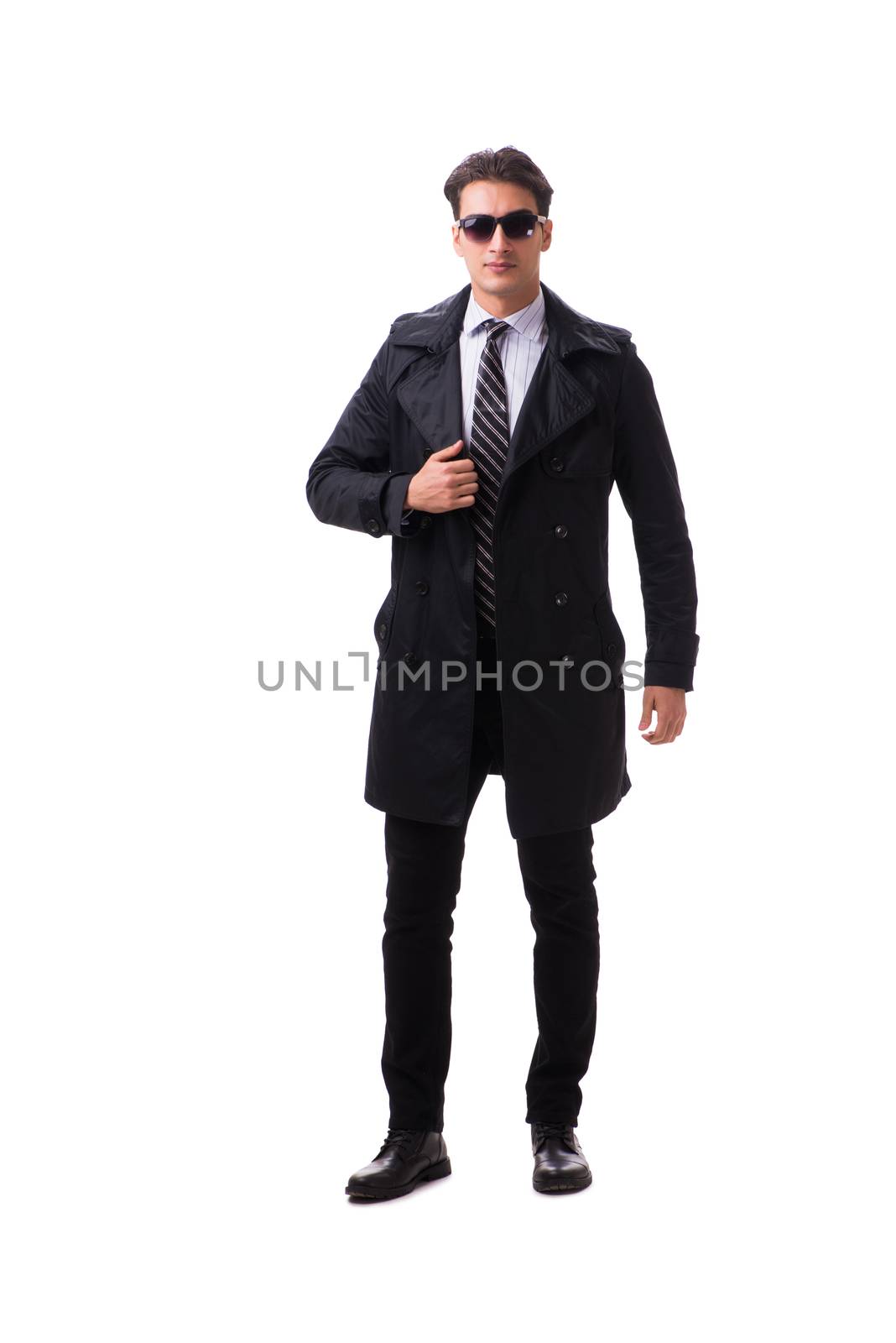 Young businessman wearing winter coat isolated on white