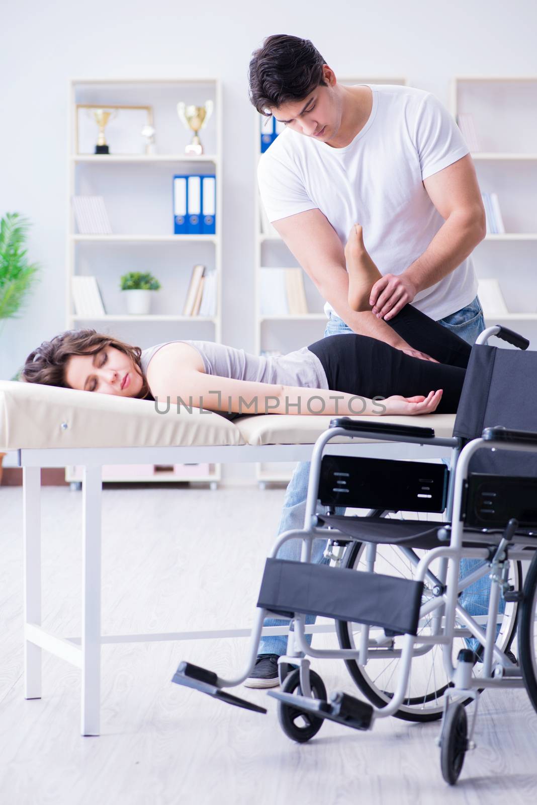 Patient undergoing rehabilitation recovery programme with doctor