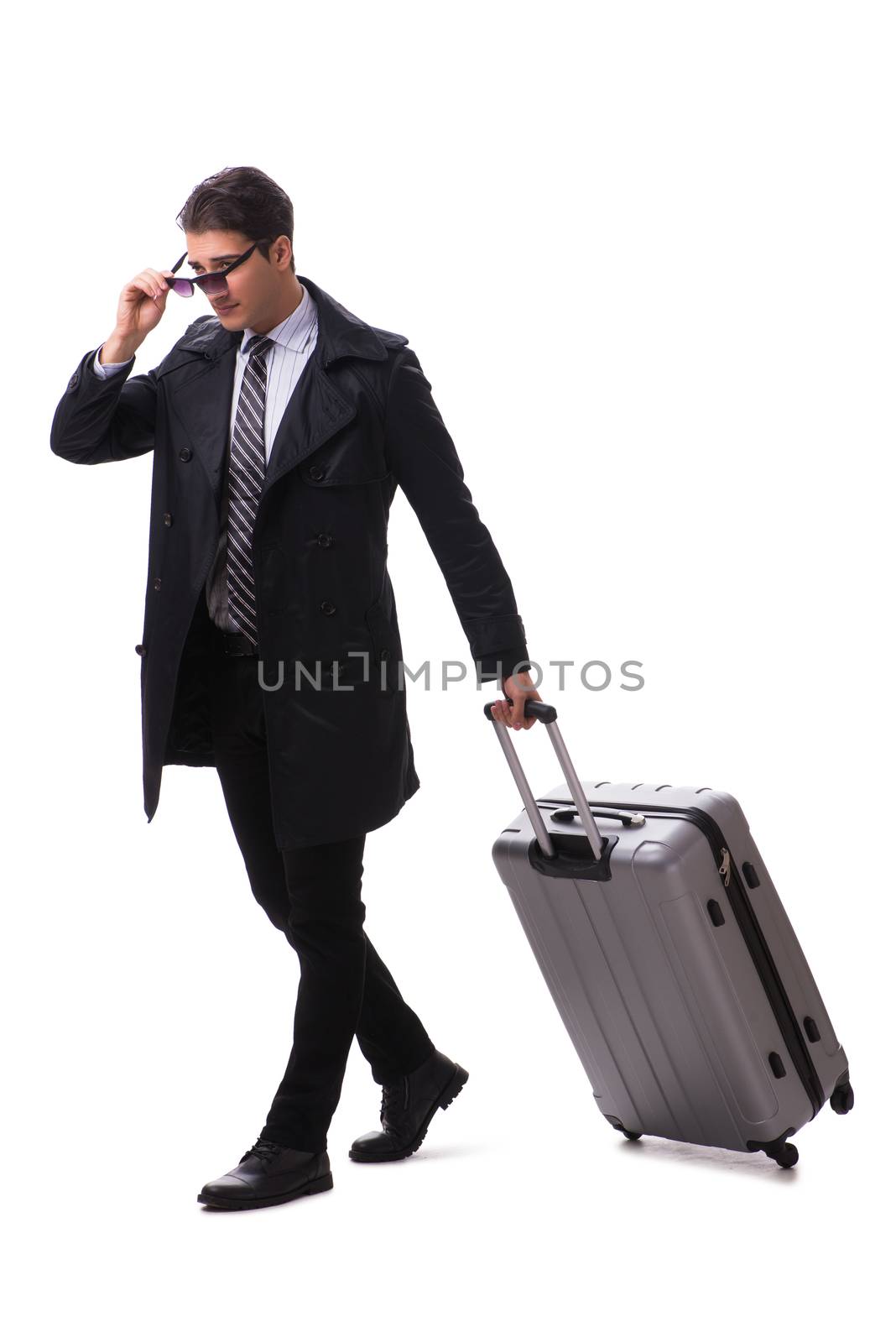 Young businessman with suitcase ready for business trip on white
