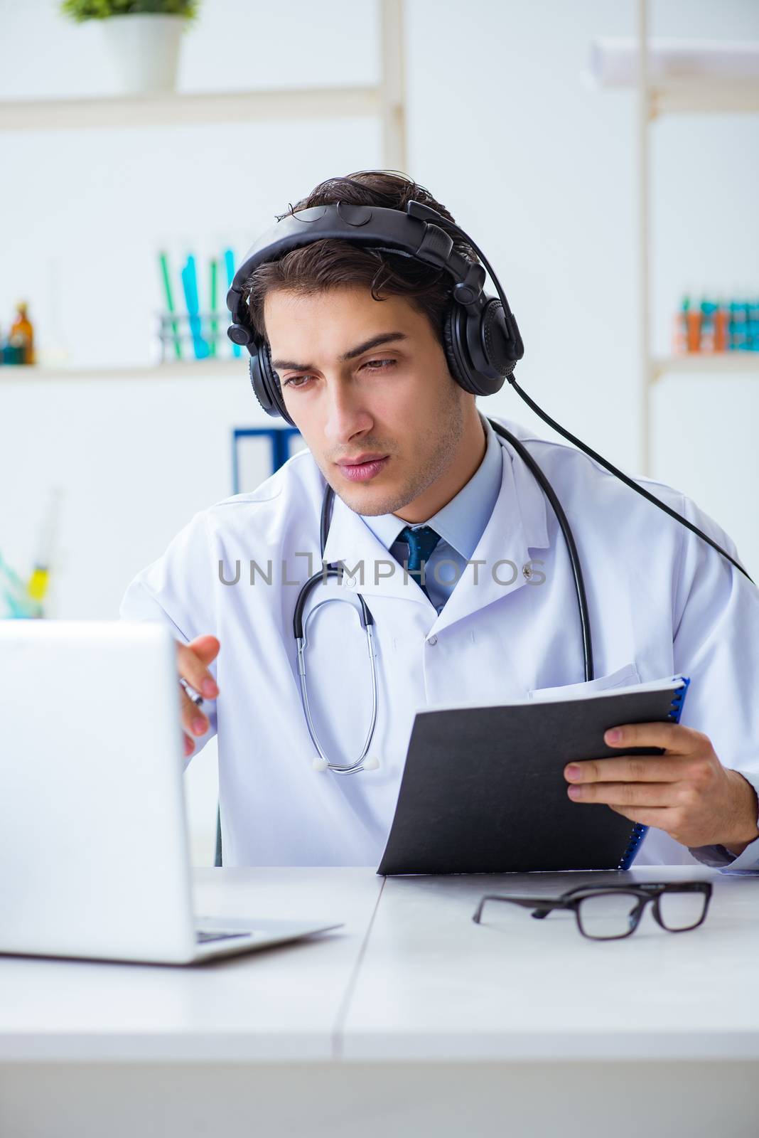 Male doctor listening to patient during telemedicine session