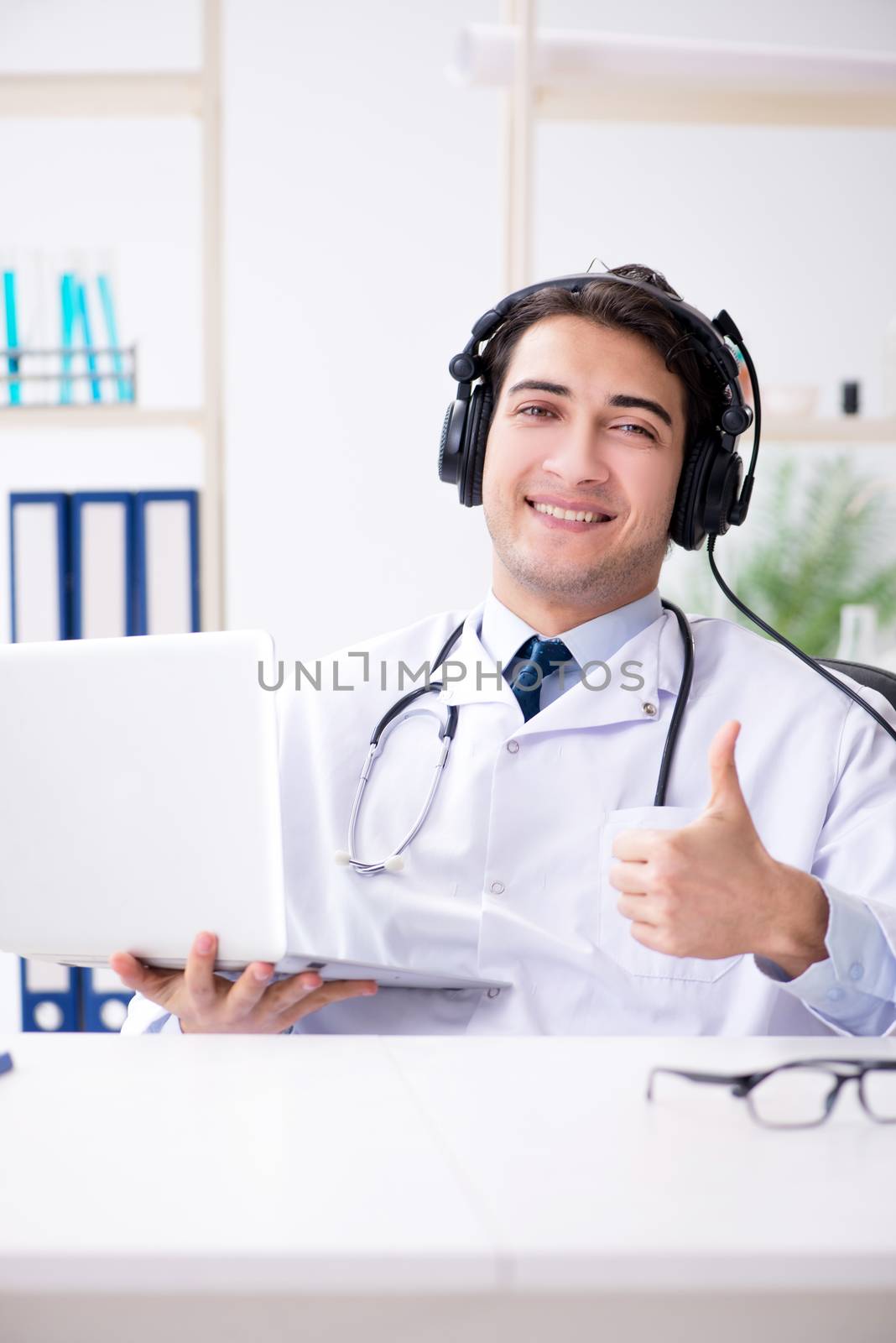 Male doctor listening to patient during telemedicine session