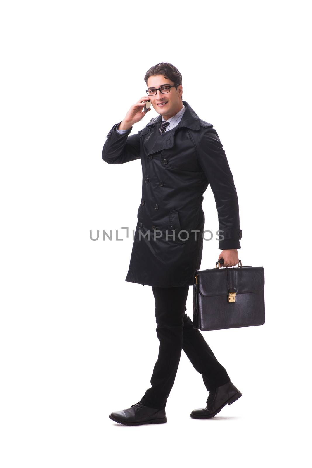 Young businessman wearing winter coat isolated on white