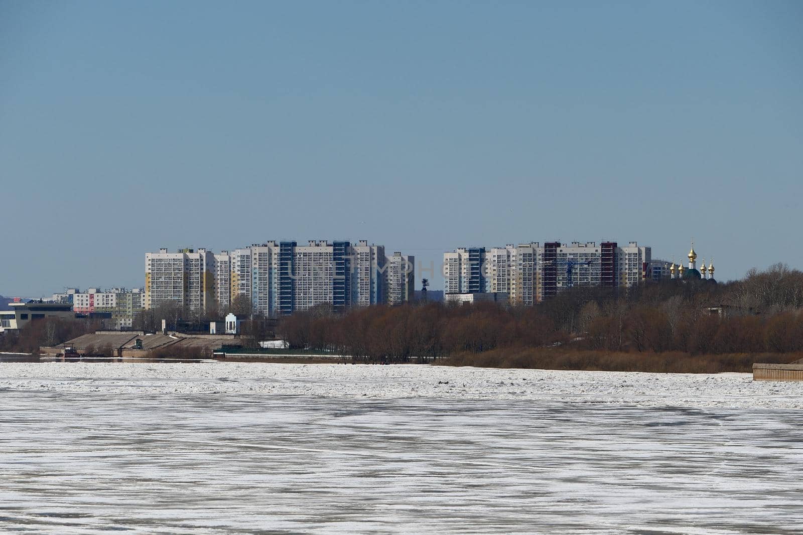 Spring ice on the river. City by the river. Nature, ecology. High quality photo