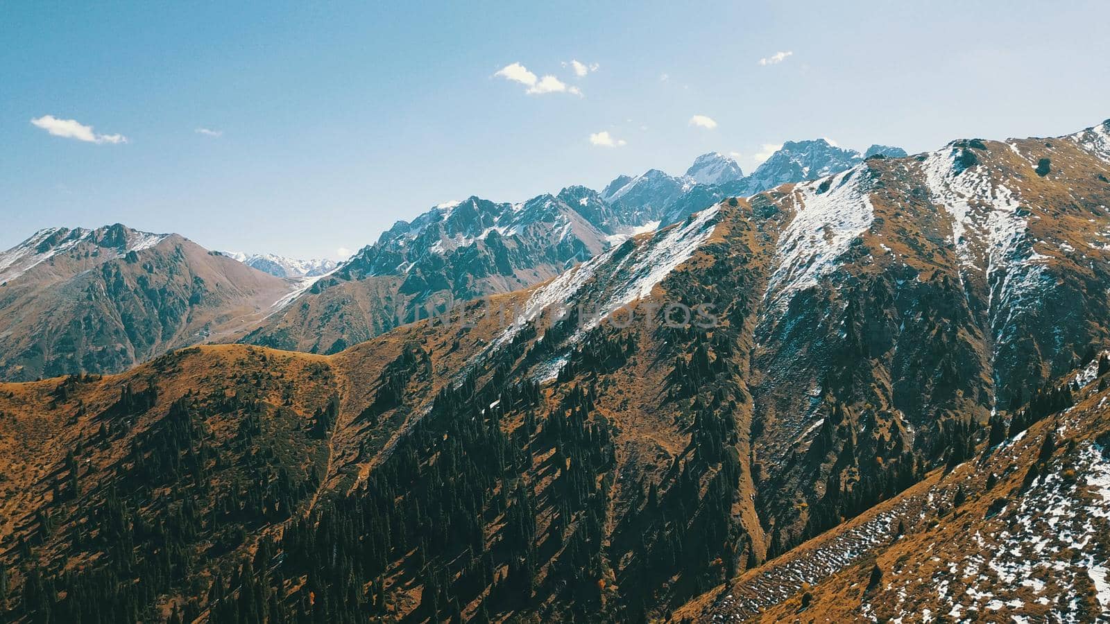 Autumn mountains covered with snow in places. by Passcal