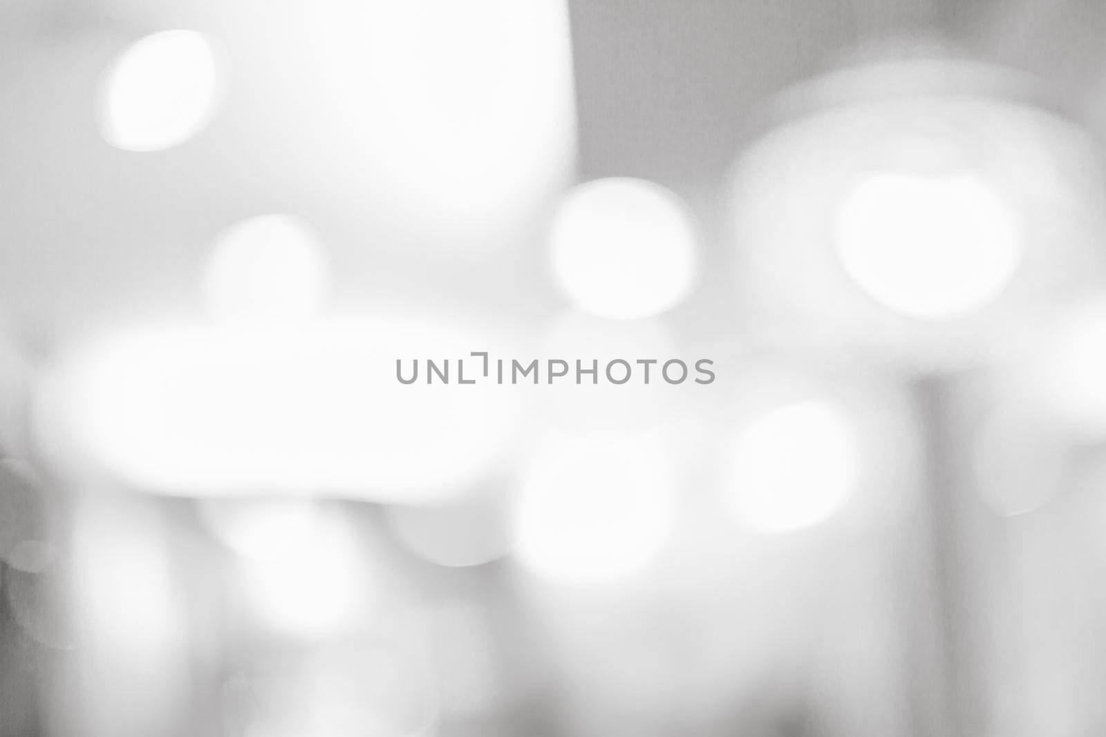 Grey or White blurred of department store background. Defocused blur background