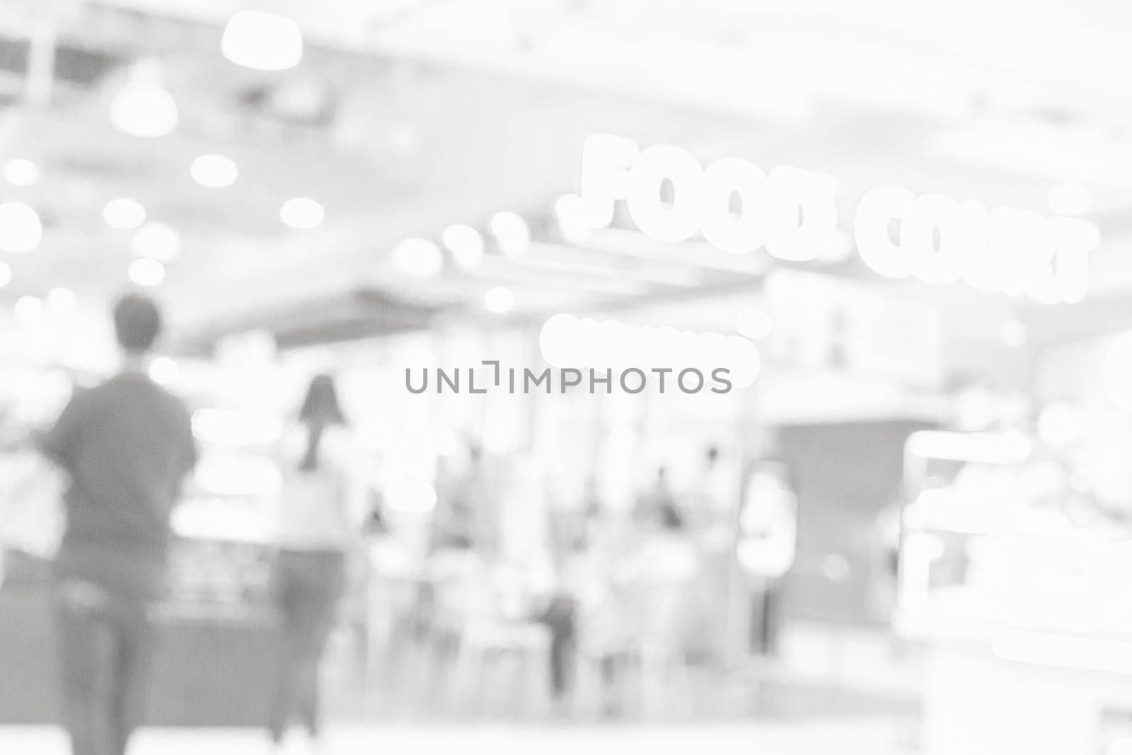 Grey or White blurred of department store background. Defocused blur background