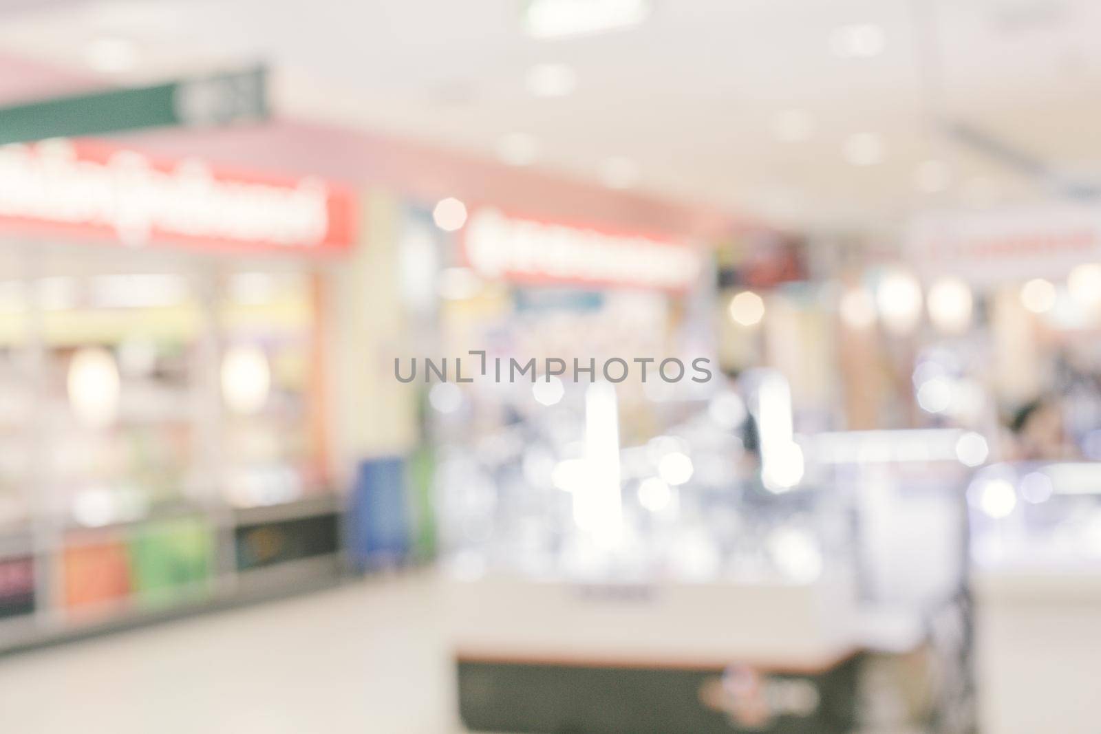 Abstract blur department store with shopping mall interior for background.abstract blur in supermarket for background.Abstract blur beautiful luxury shopping mall and retails store interior