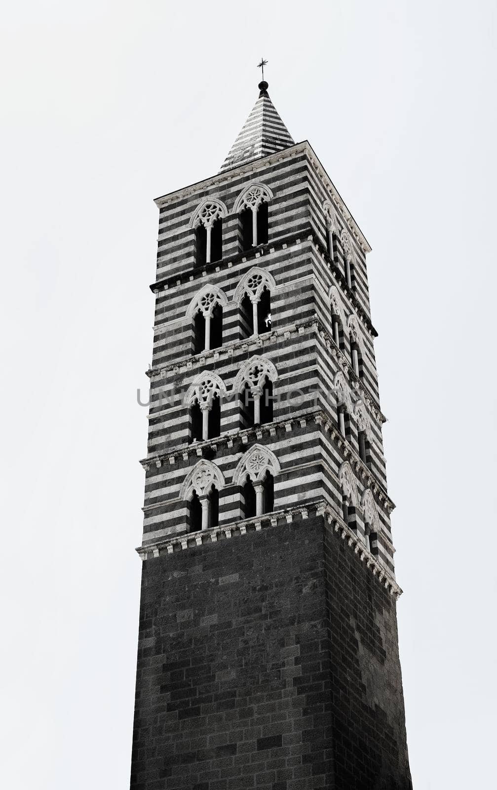 VITERBO-ITALY-August 2020-Bell tower of San Lorenzo cathedral ,built in Gothic style with alternating bands of white travertine and basalt stone and mullioned windows