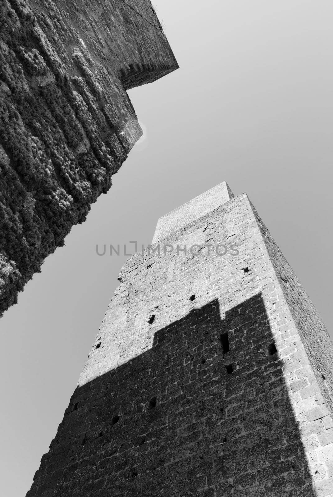 TUSCANIA -ITALY- August 2020 -two defense towers near San Pietro church in a bright sunny day-black and white photography