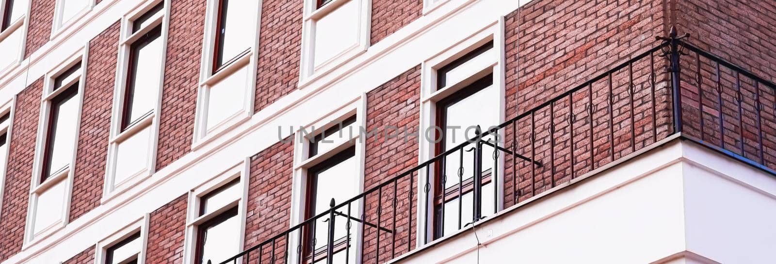 Classic architecture, old building brick facade and windows, architectural detail background.