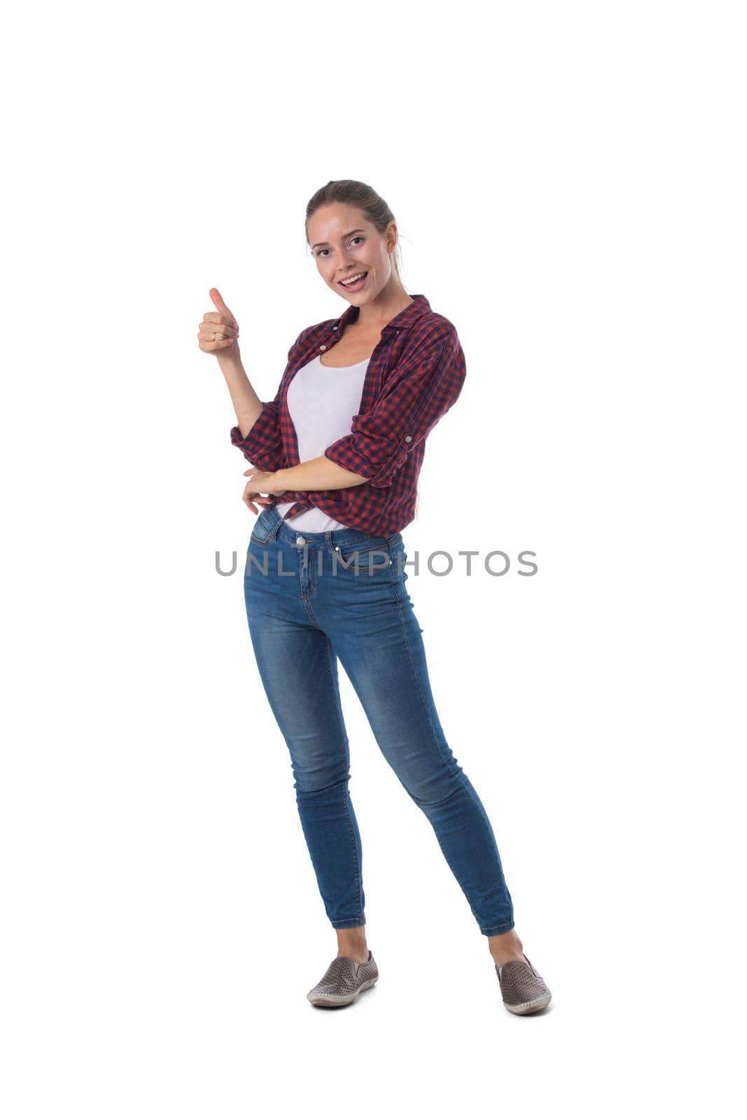 Full length portrait of smiling young woman showing thumb up symbol isolated on white background, casual people