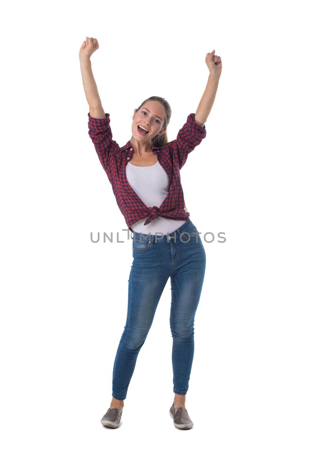Full length portrait of smiling young woman raising her arms isolated on white background, casual people