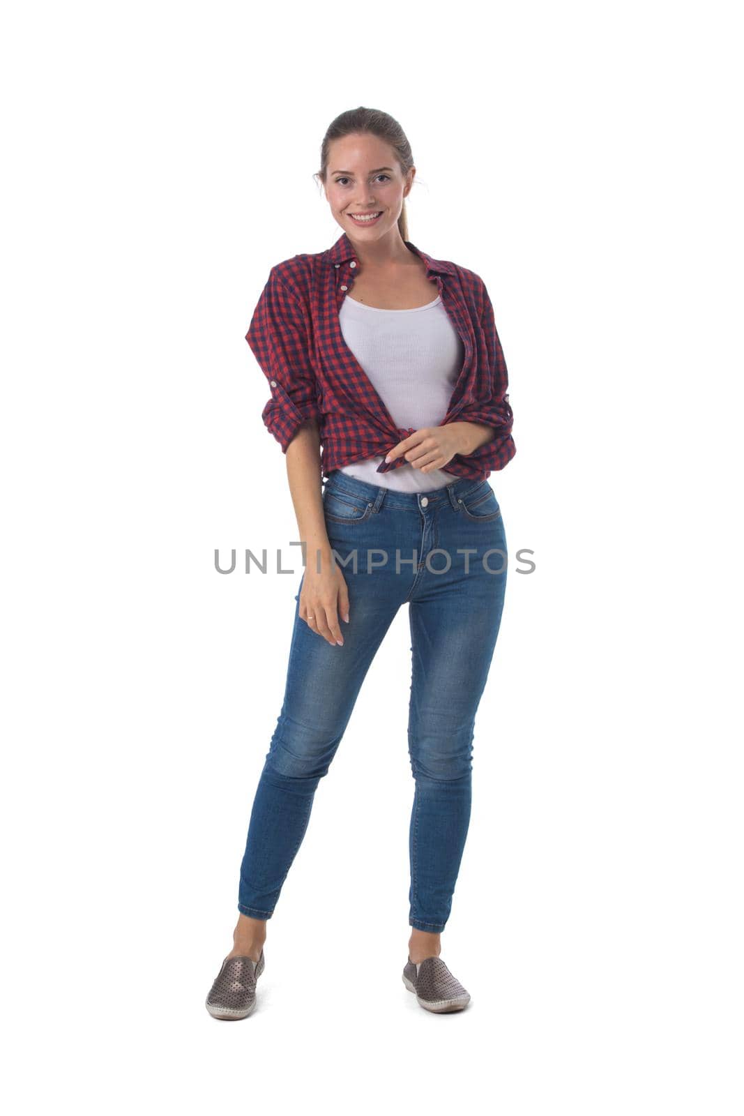 Full length portrait of young woman standing isolated on white background, casual people