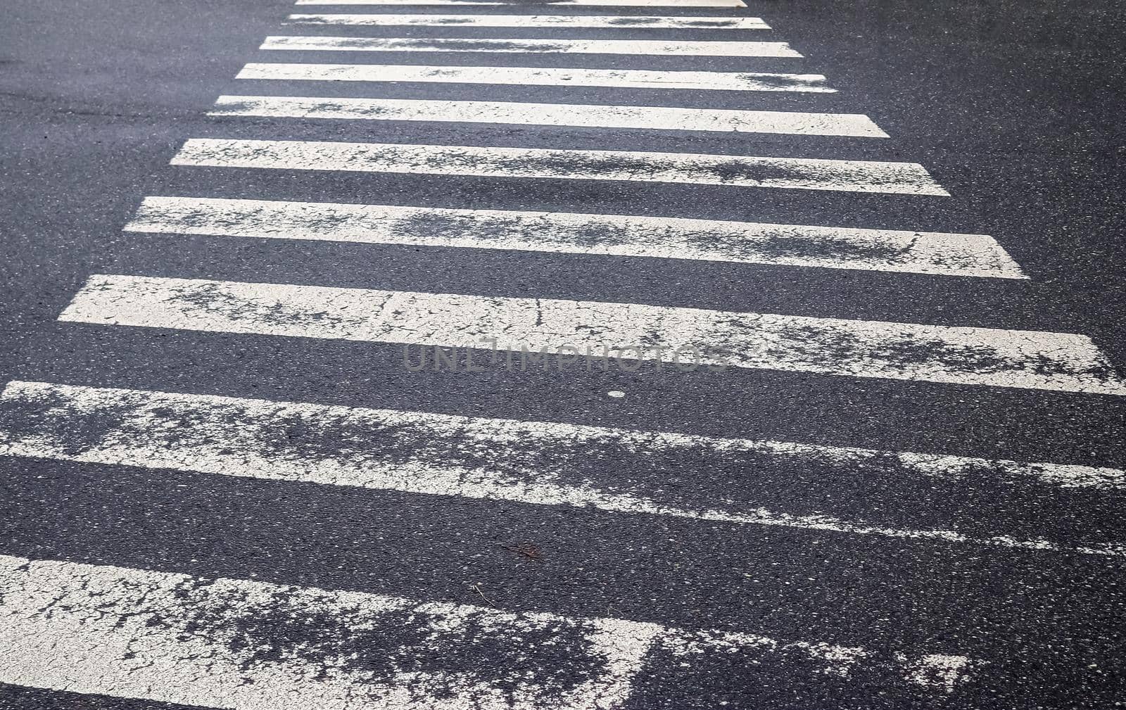 White painted pedestrian zebra crossing on a road in Europe