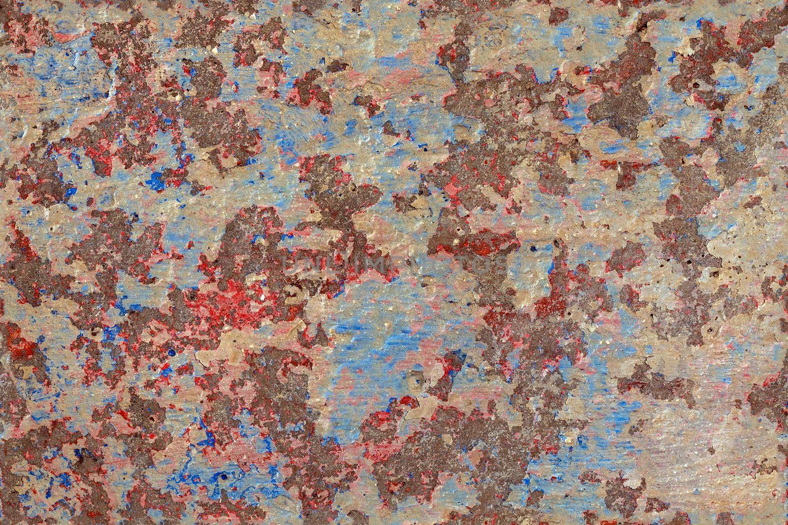 shabby peeled white, blue and red paint layers on concrete surface - flat background and texture.