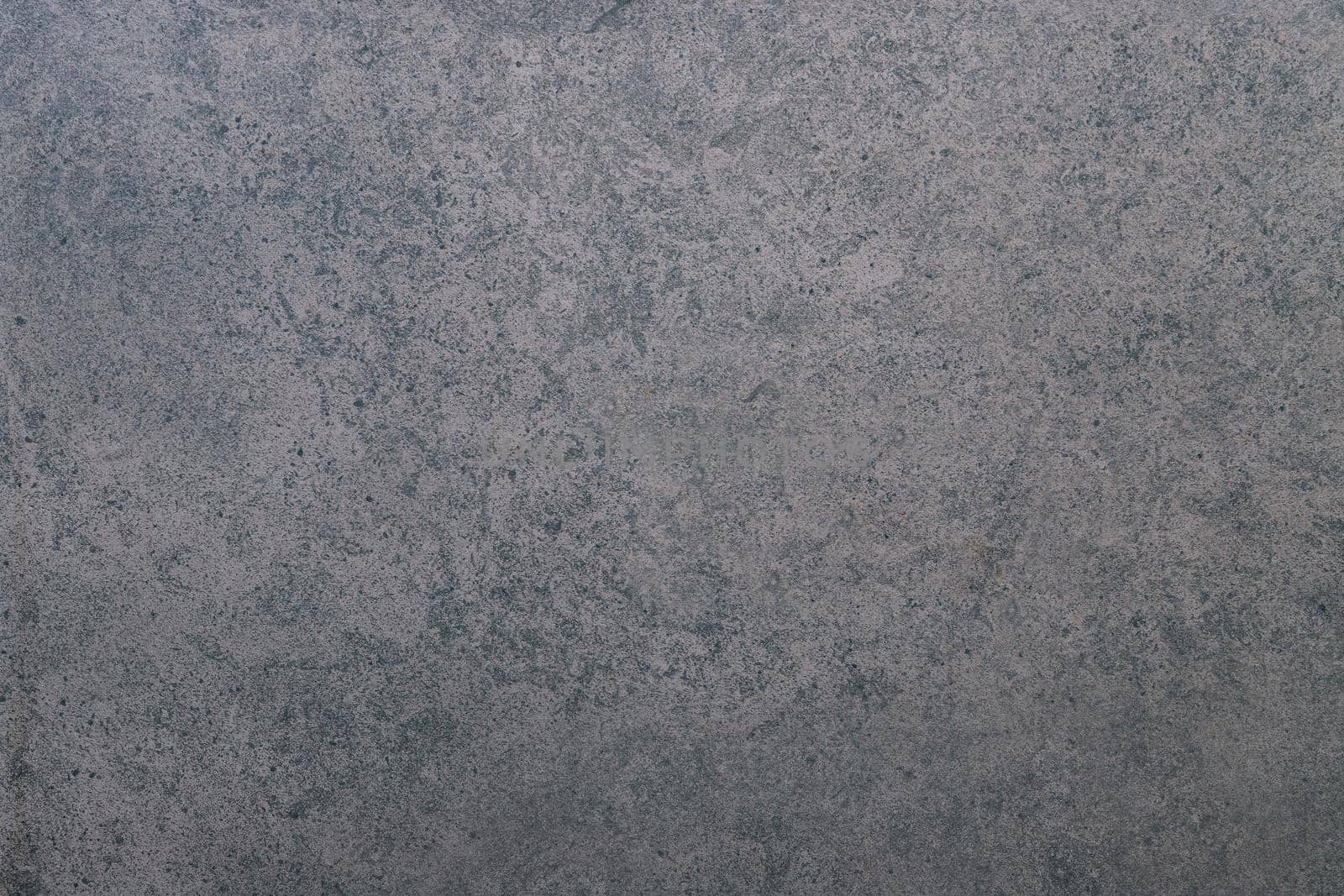 Dark stone wall texture background. Natural black slate concrete background pattern. by kerdkanno