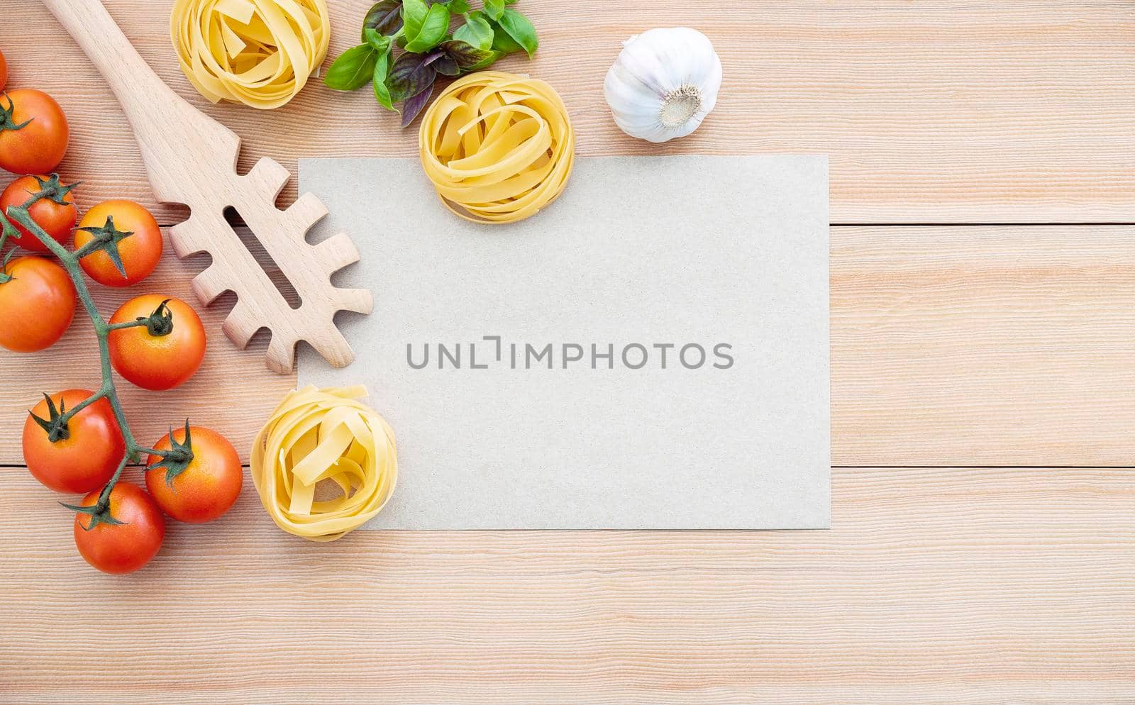Italian foods concept and menu design . The ingredients for homemade pasta with copy space on wooden background. by kerdkanno