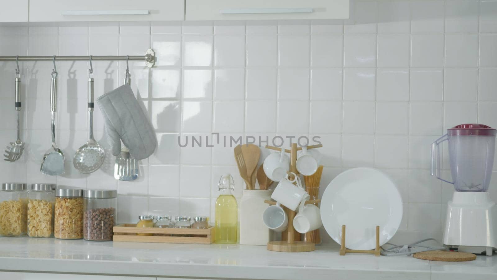 modern new interior of kitchen with white furniture by Sorapop