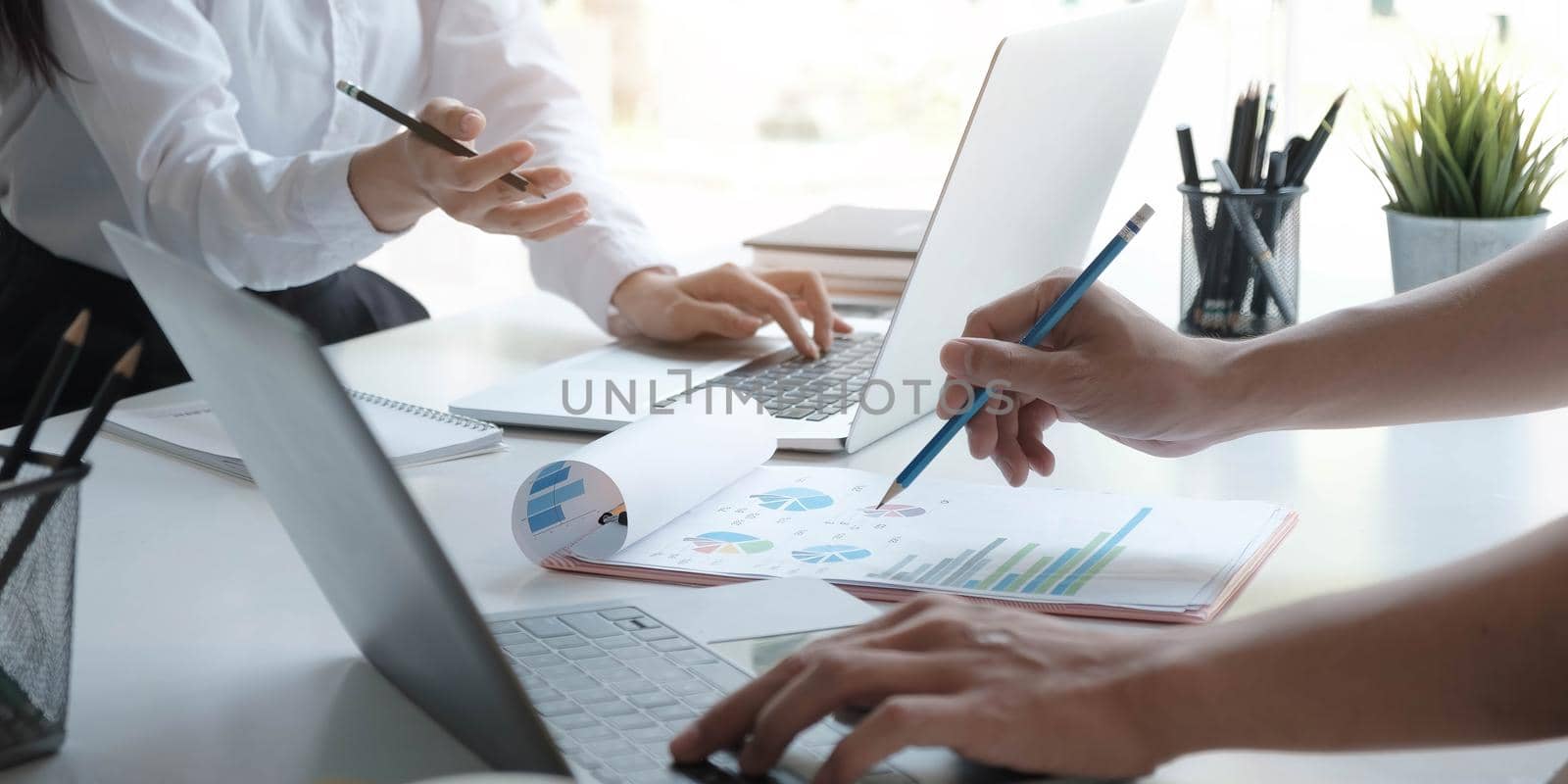 Close up Business people meeting to discuss the situation on the market. Business Financial Concept by wichayada