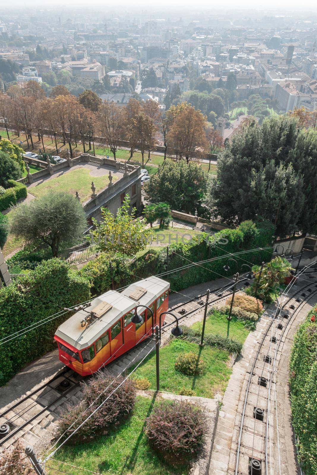 Red funicular in the old city of Bergamo by germanopoli