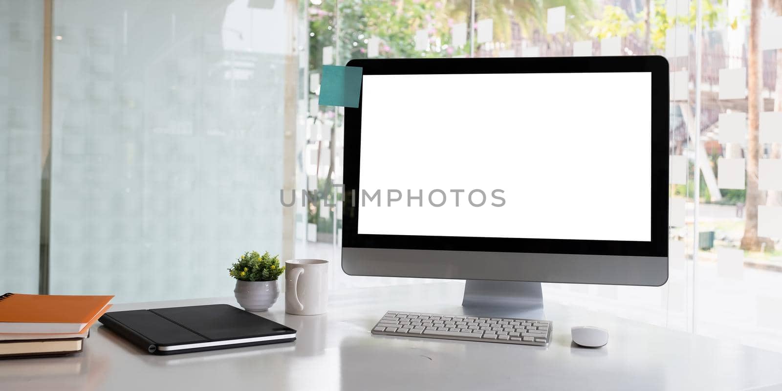 White blank screen monitor on modern working desk
