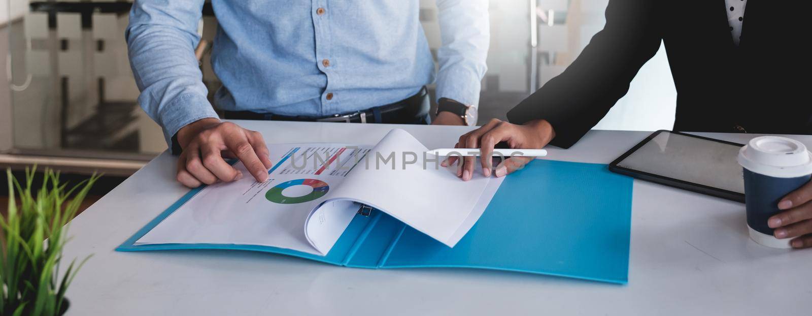 Group of Businessman and Accountant checking data document on digital tablet for investigation of corruption account . Anti Bribery concept. by itchaznong