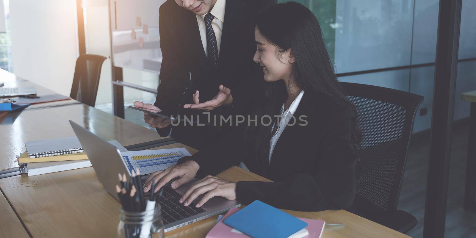 Group of Businessman and Accountant checking data document on digital tablet for investigation of corruption account. Anti Bribery concept. by itchaznong