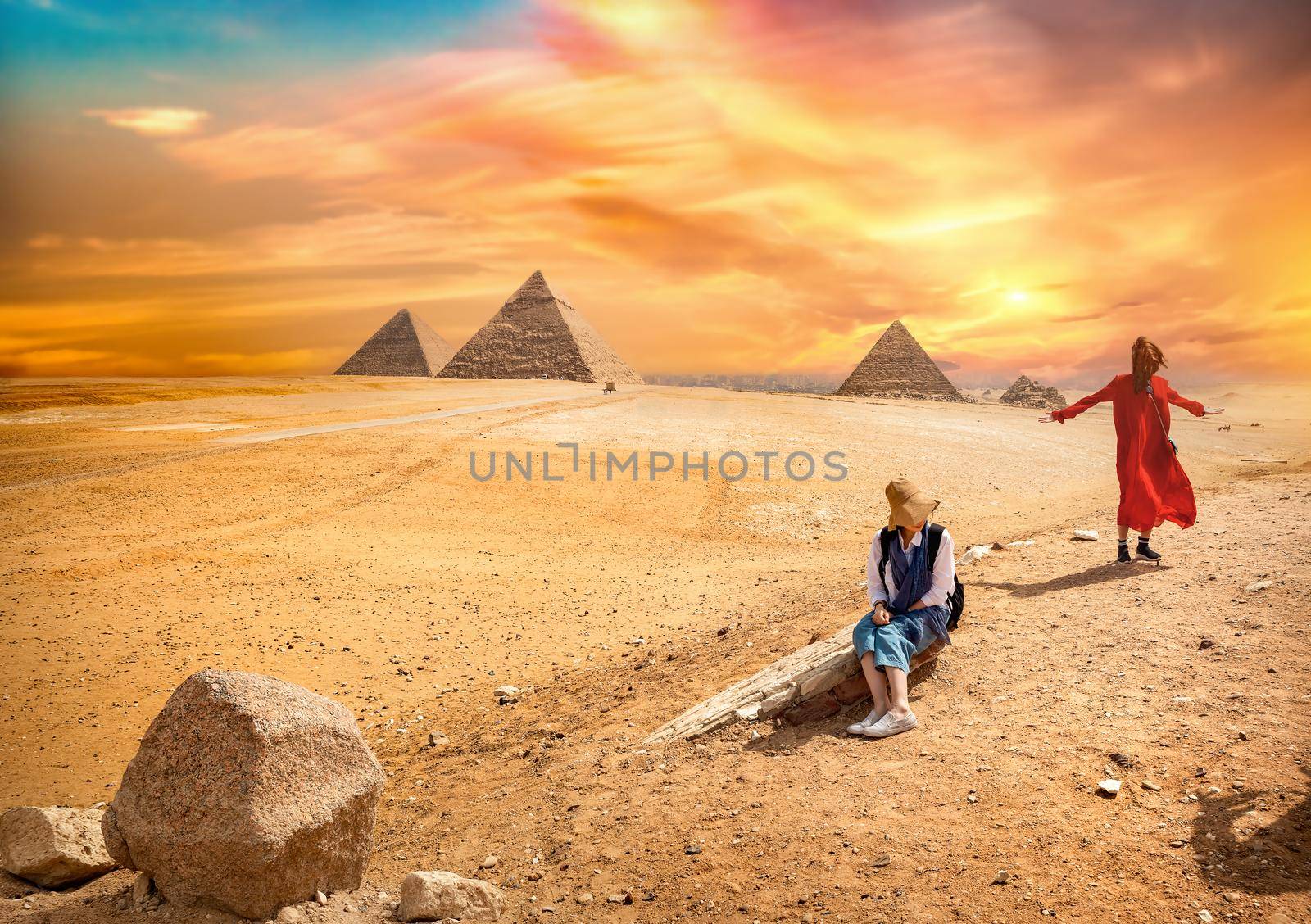 Tour near the egyptian pyramids at colorful sunset