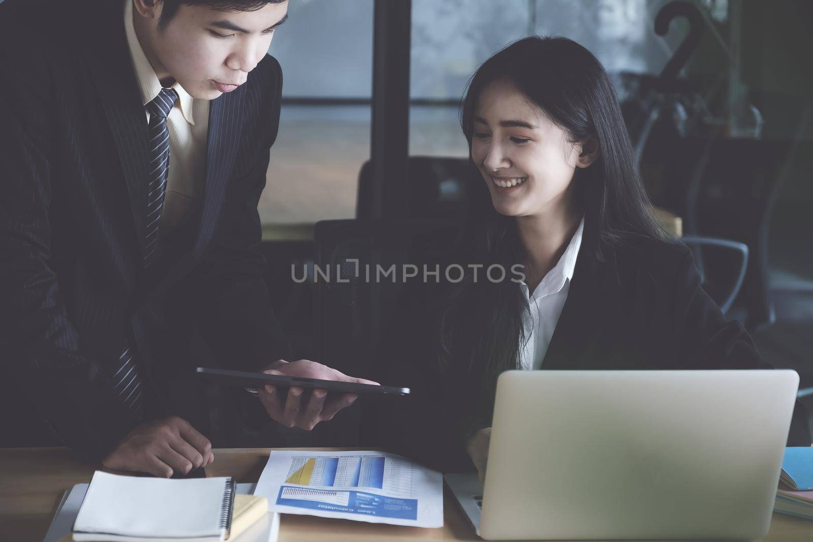 Group of Businessman and Accountant checking data document on digital tablet for investigation of corruption account. Anti Bribery concept. by itchaznong