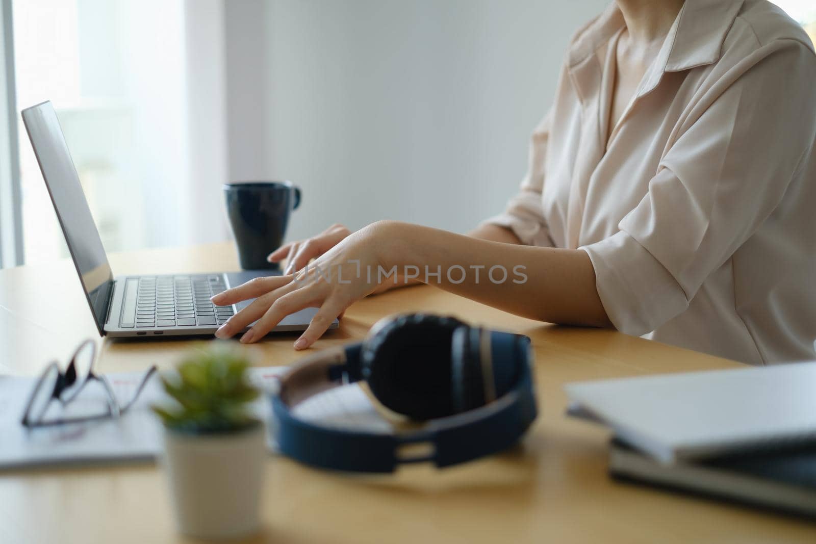 Video conference, Online meeting video call, close up of business woman looking at laptop computer screen working or watching webinar on laptop in home office. work from home concept. by itchaznong