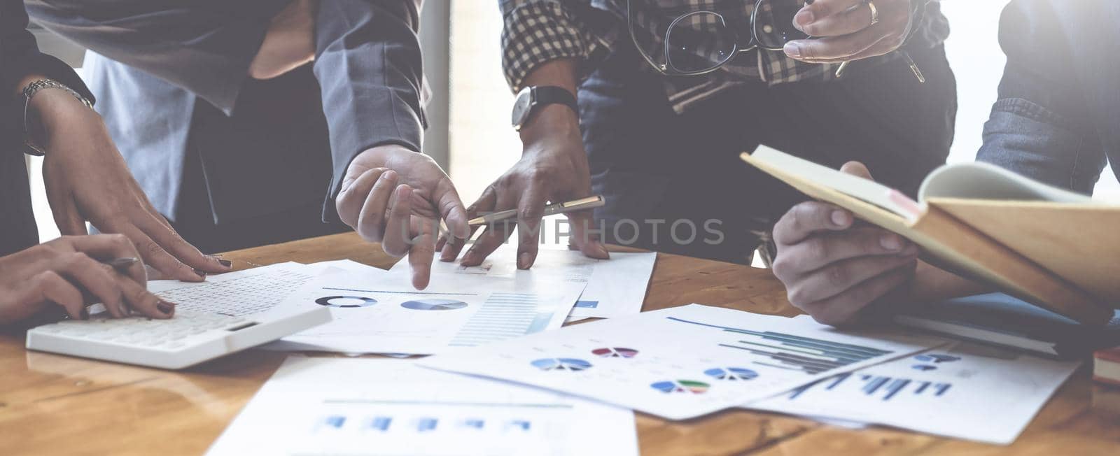 Group of Businessman and Accountant checking data document on digital tablet for investigation of corruption account . Anti Bribery concept. by itchaznong