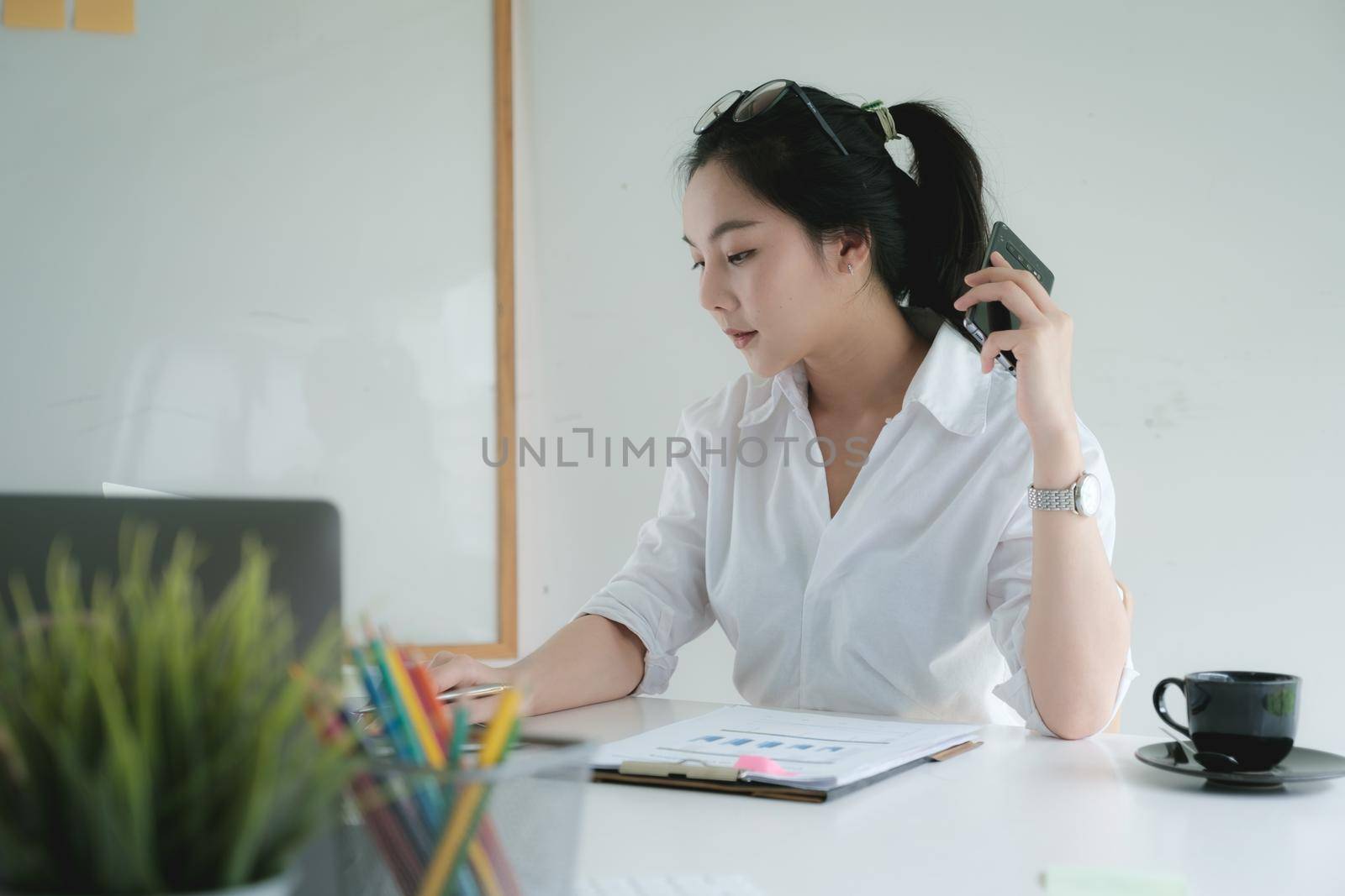 Portrait of Asian Business woman working from home. Accounting concept