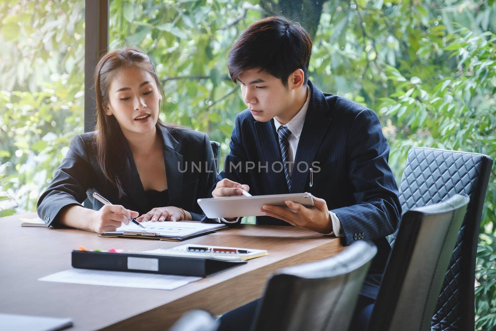 Business partner cooperation discussing investment trading do this deal on a stock exchange.