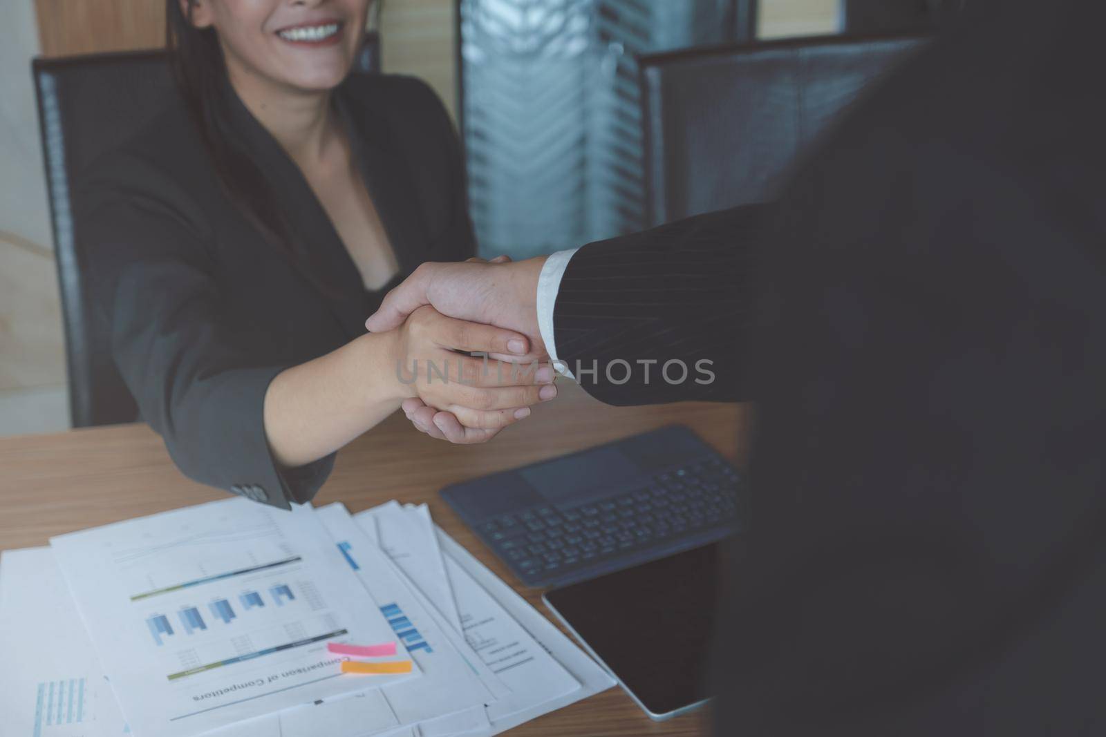 Image of Successful businessmen partnership handshaking after acquisition. Meeting for sign contracts and Group support concept