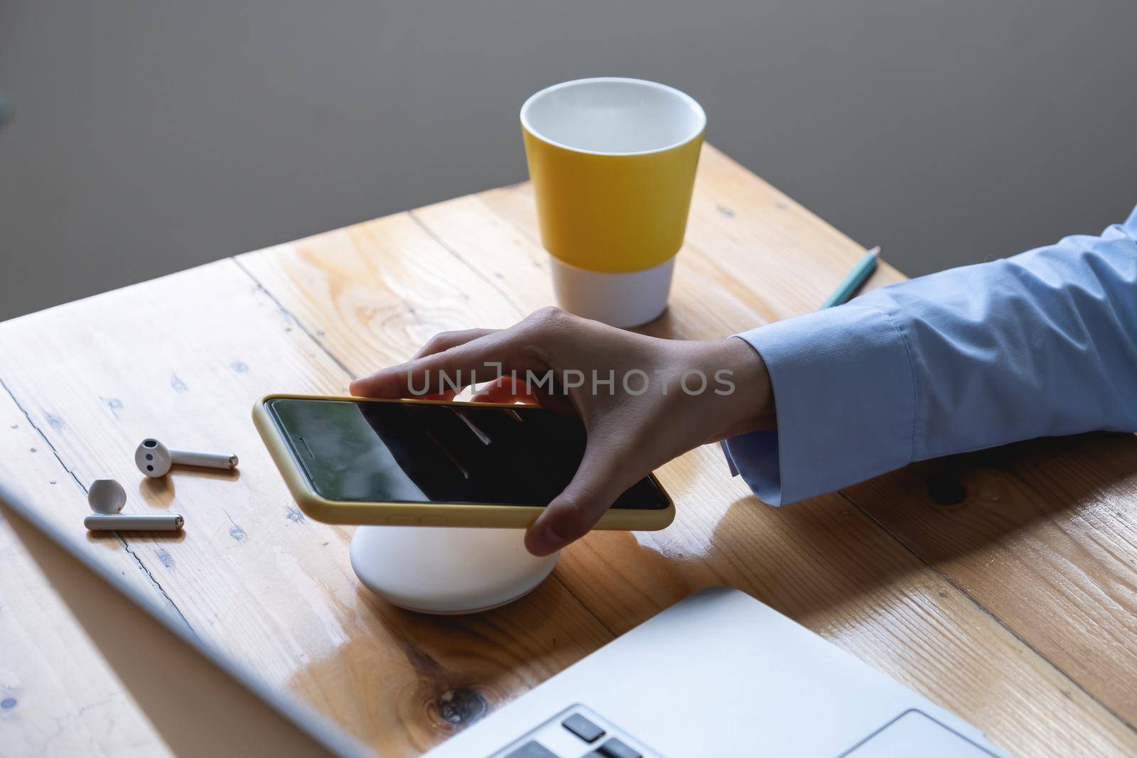 Woman using wireless charging . technology concept