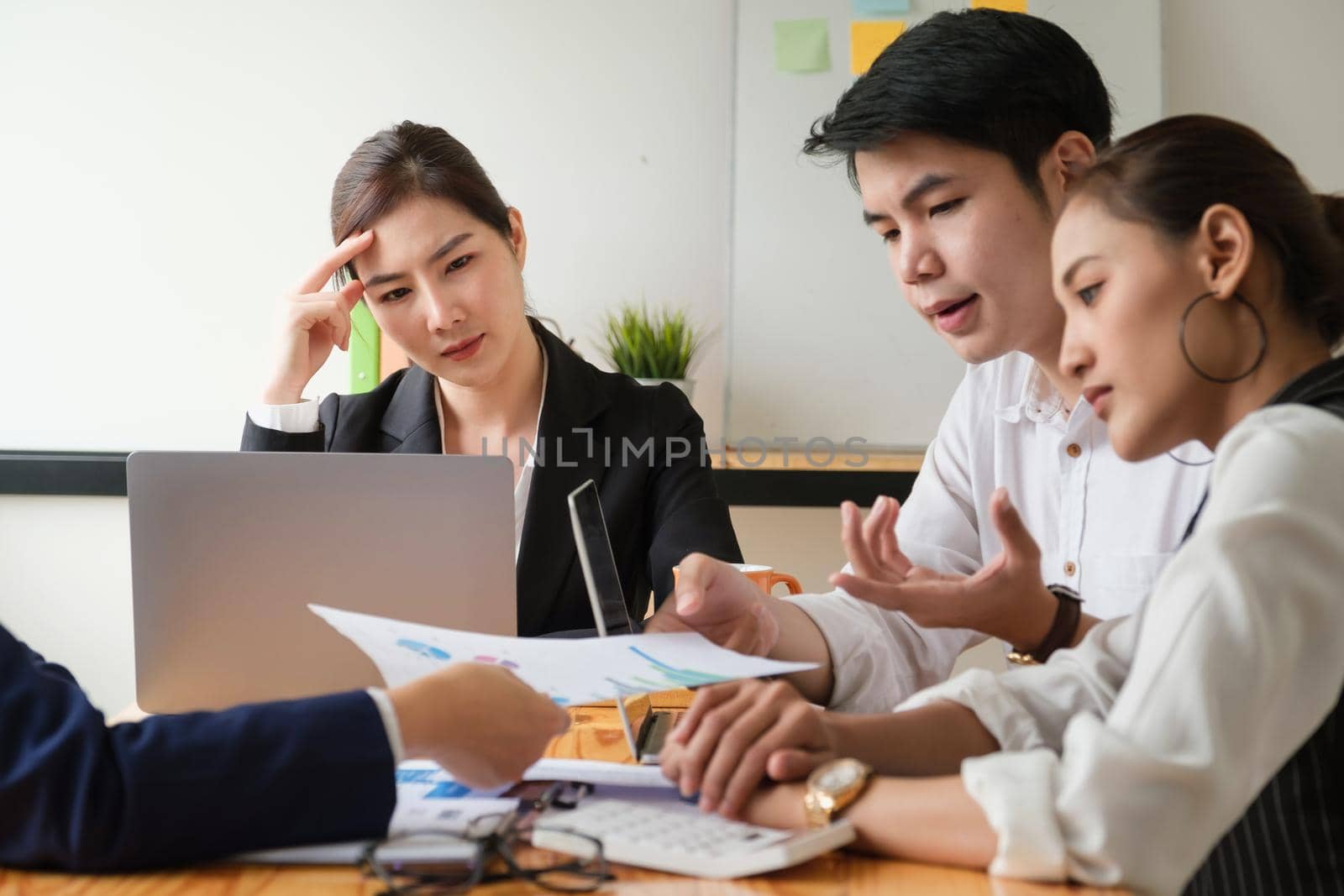 Group of Businessman and Accountant checking data document on digital tablet for investigation of corruption account . Anti Bribery concept. by itchaznong