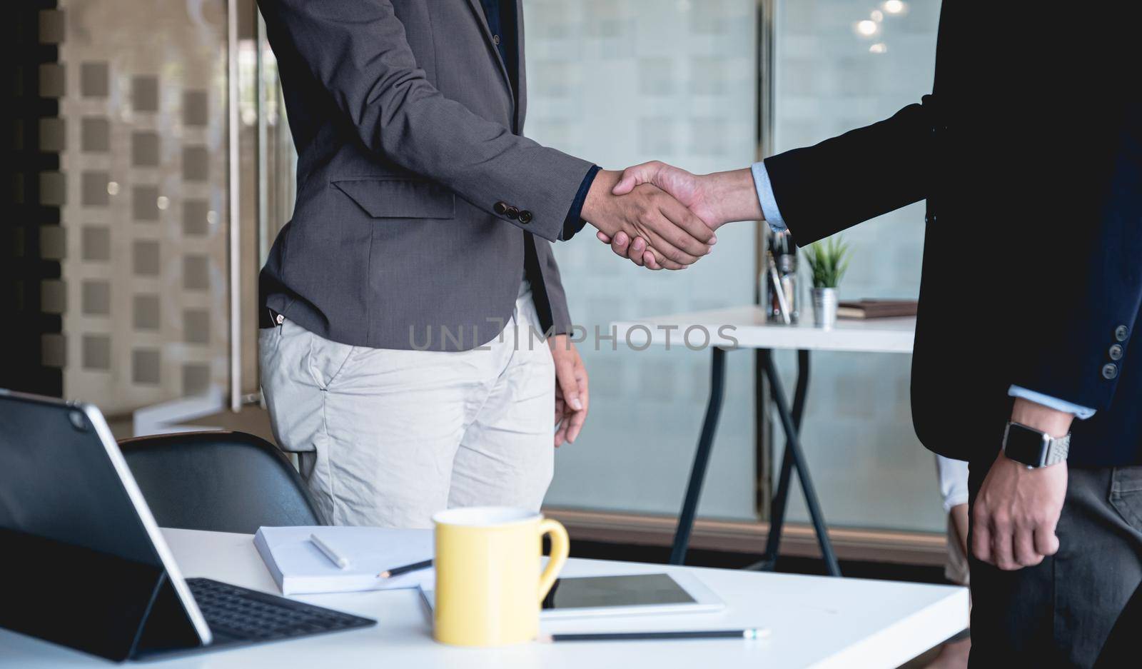 Business partnership meeting concept. Image businessmans handshake. Successful businessmen handshaking after good deal. by itchaznong