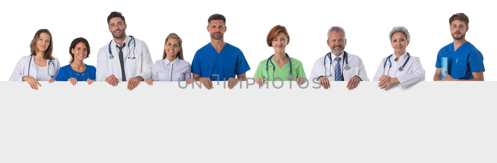 Group of doctors with blank banner by ALotOfPeople