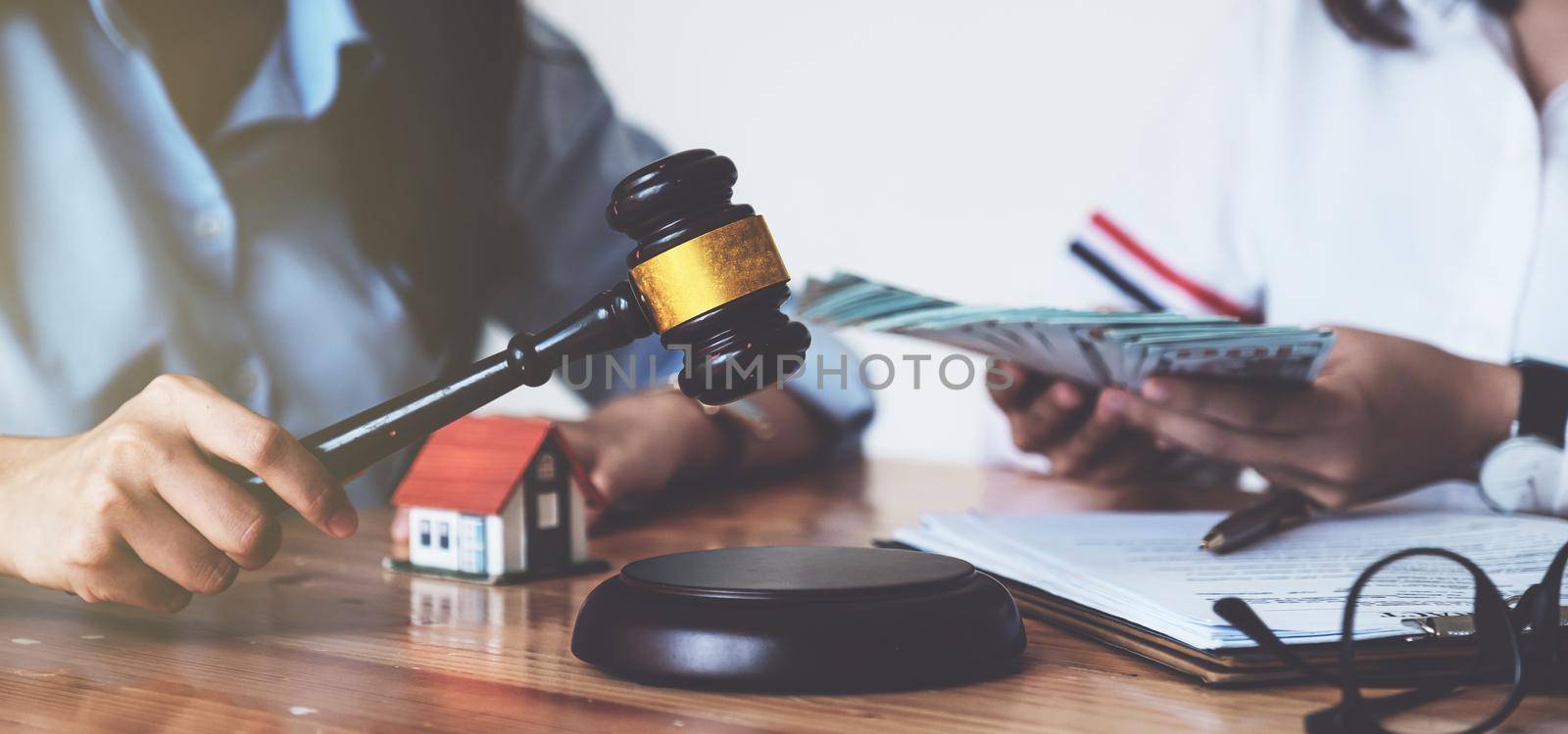 Business woman and lawyers discussing contract papers on wooden desk in office. Law, legal services, advice, Justice concept. by itchaznong