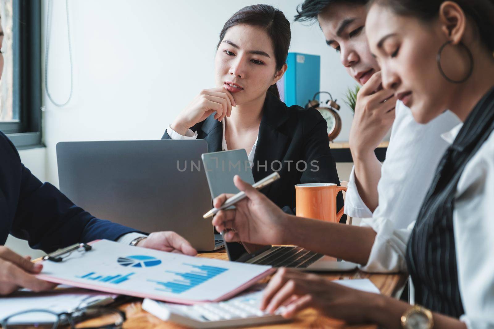 Fund managers team consultation and discuss about analysis Investment stock market by digital tablet