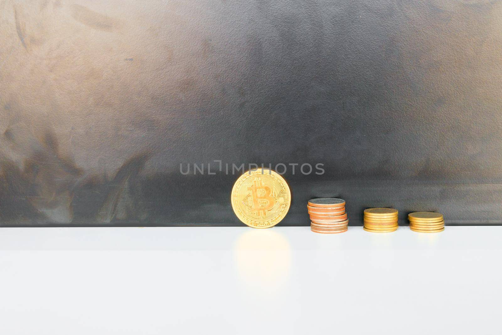 bitcoin coins and money stack over white on black background. with copy space add text