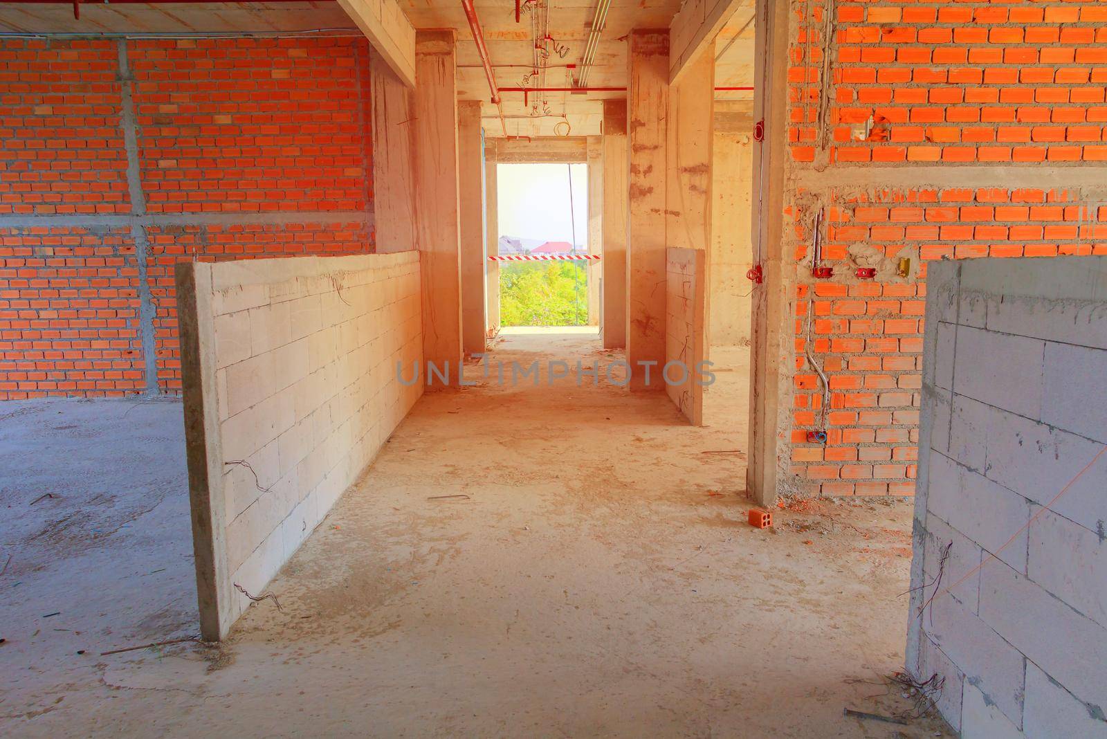 interior in construction and wall decoration at building site with sun light tone