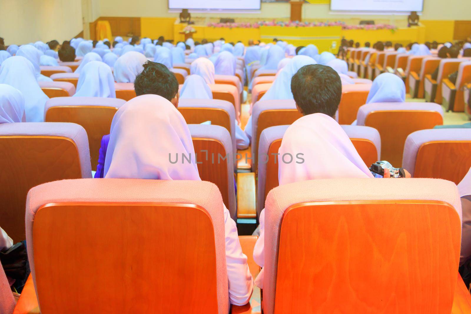 Students education sit on chair orange interior classroom learning in university